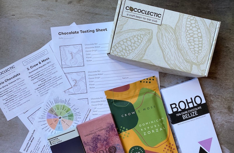 chocolate tasting kit with 4 chocolate bars, tasting sheet, tasting notes and flavor wheel